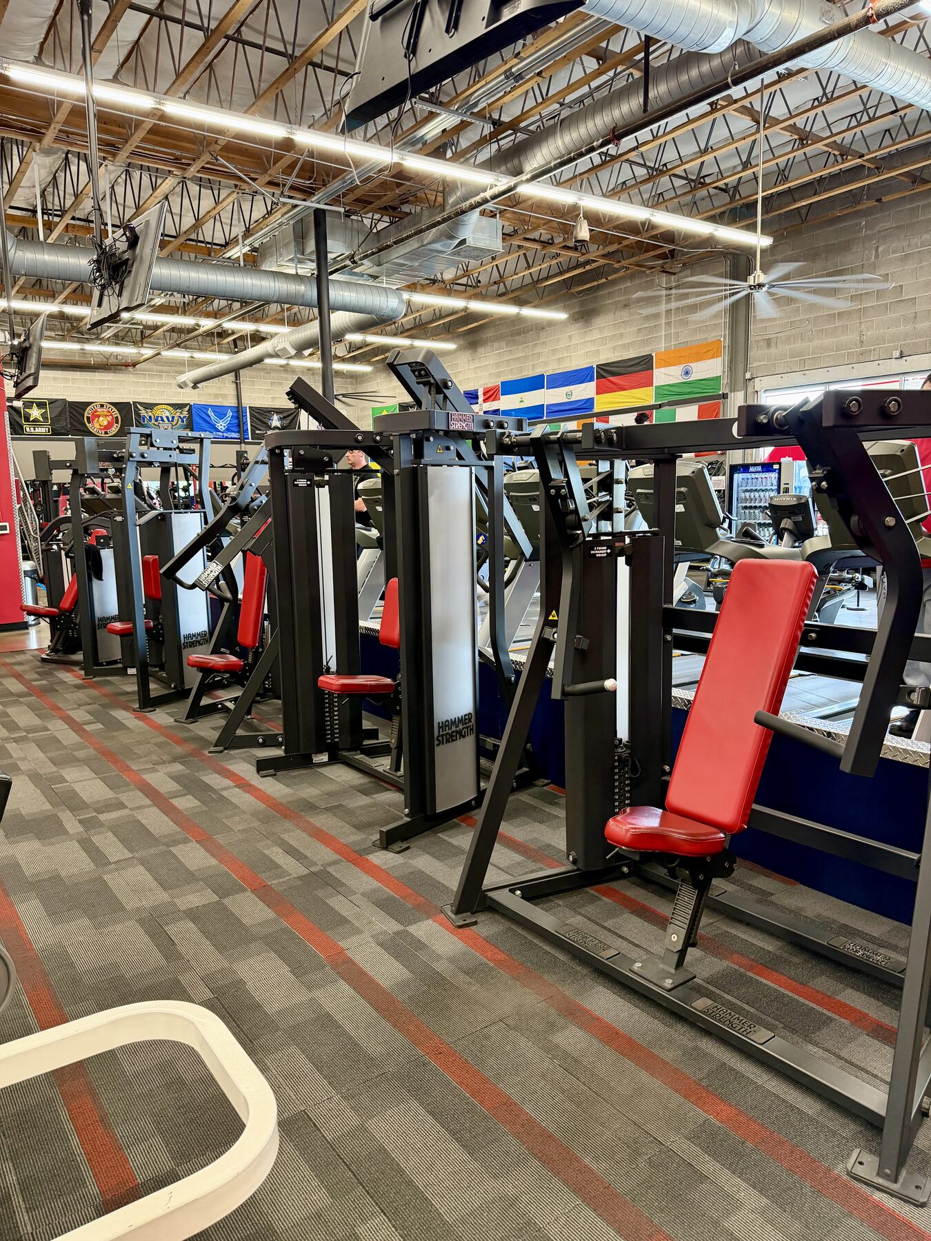 Row of selectorized strength machines on the main floor