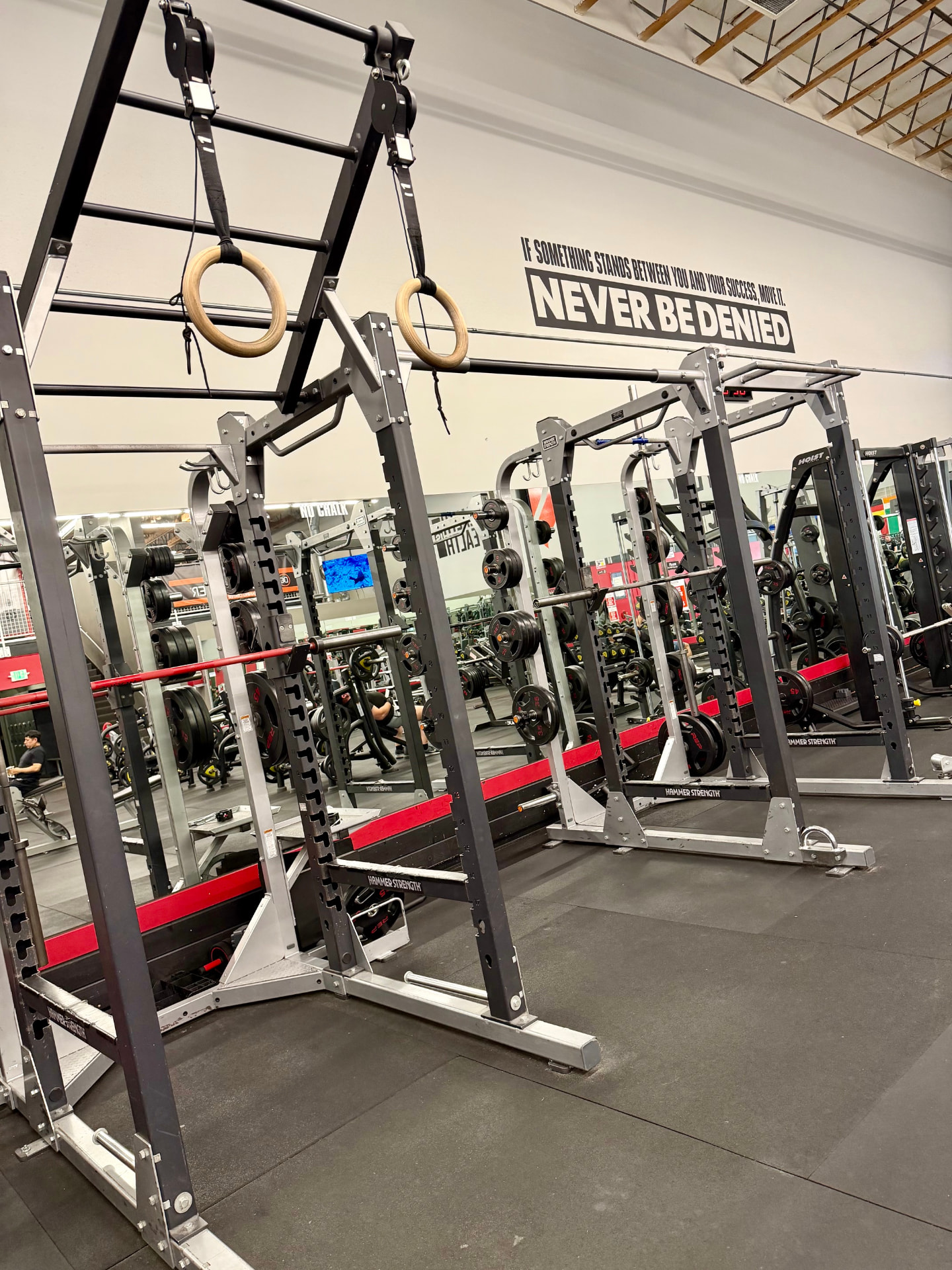 Power racks and gymnastic rings on the strength floor